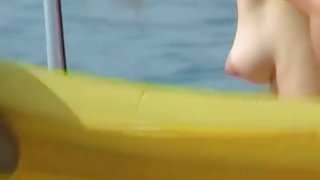 Hot pointy tits and a girl with a shaved head in this beach video