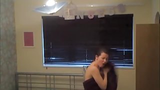 Sweet brunette singing and changing after the shower
