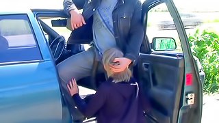 Sweet blonde is sucking a hard dick outdoors