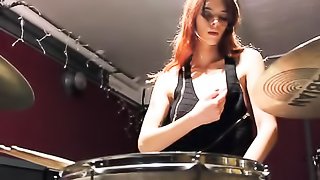 Exquisite redhead in a black dress shows off in self sex fun in an instrumental room