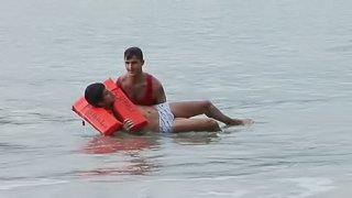 Horny gay fellow fucks a lifeguard on a nice beach